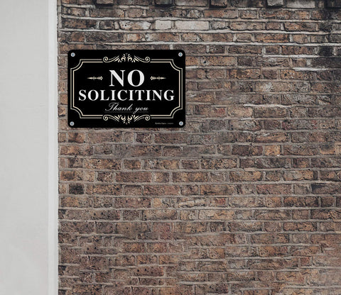 Faittoo No Soliciting Sign visible at night under headlights.