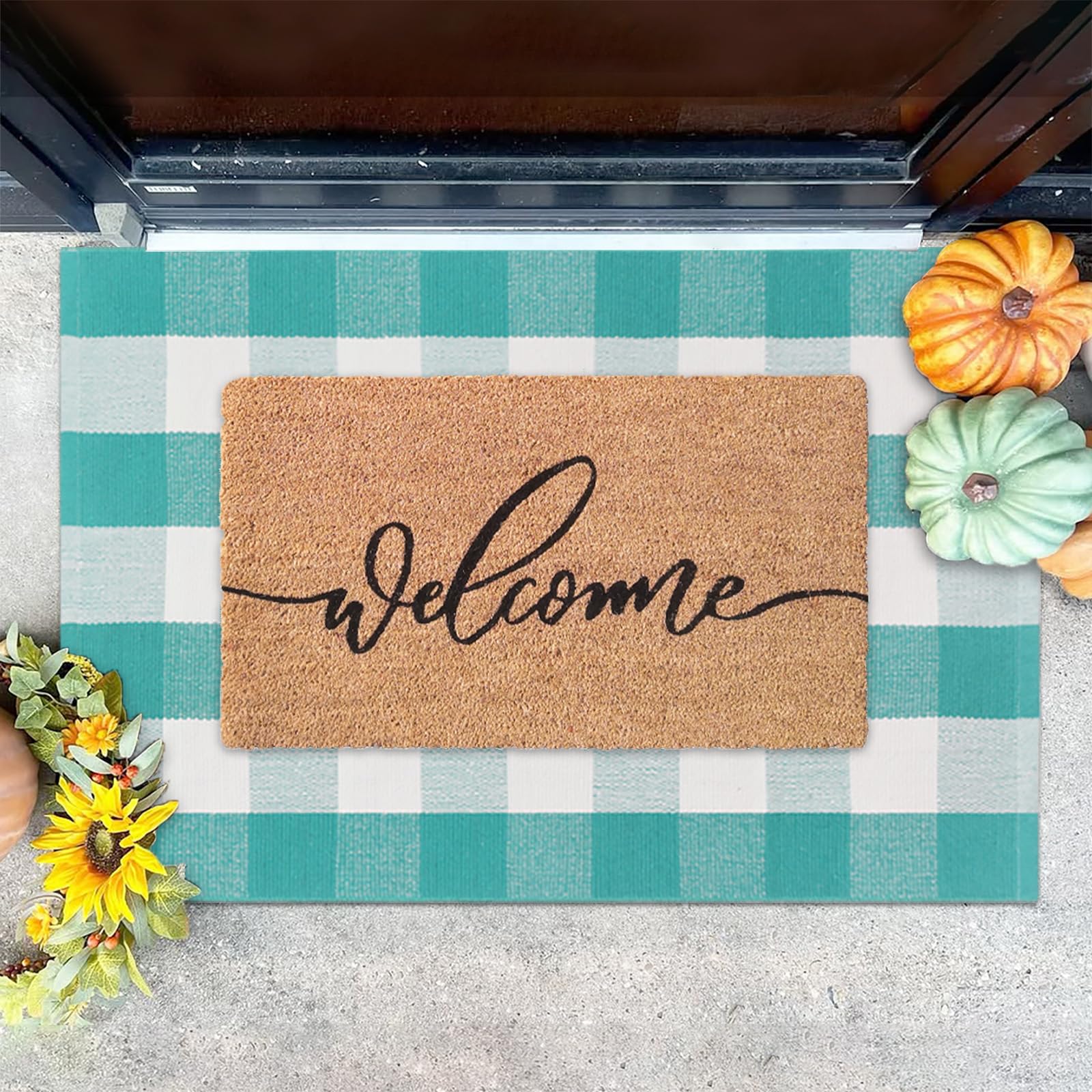 Fallovea front porch setup with mats creates inviting entryway for guests.