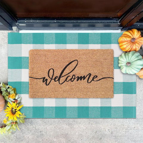 Fallovea front porch setup with mats creates inviting entryway for guests.