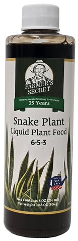 Farmer’s Secret snake plant liquid fertilizer bottle boosts root strength for healthier growth.