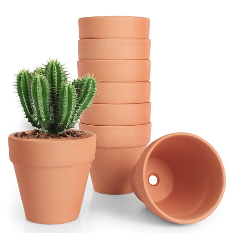 FCFKUK 4-inch terracotta pot with drainage holes, ideal for indoor plants.