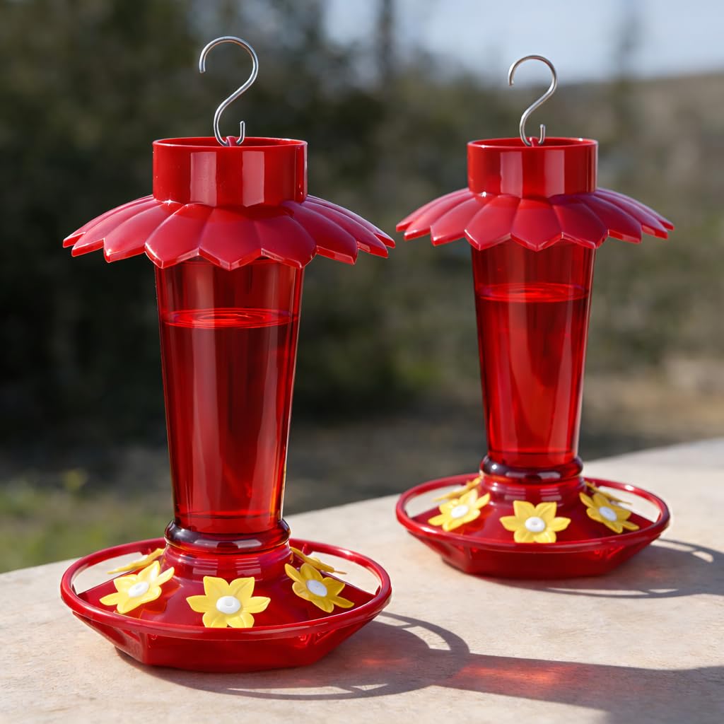 Fchstaer red umbrella-top hummingbird feeder shields nectar from sun outdoors
