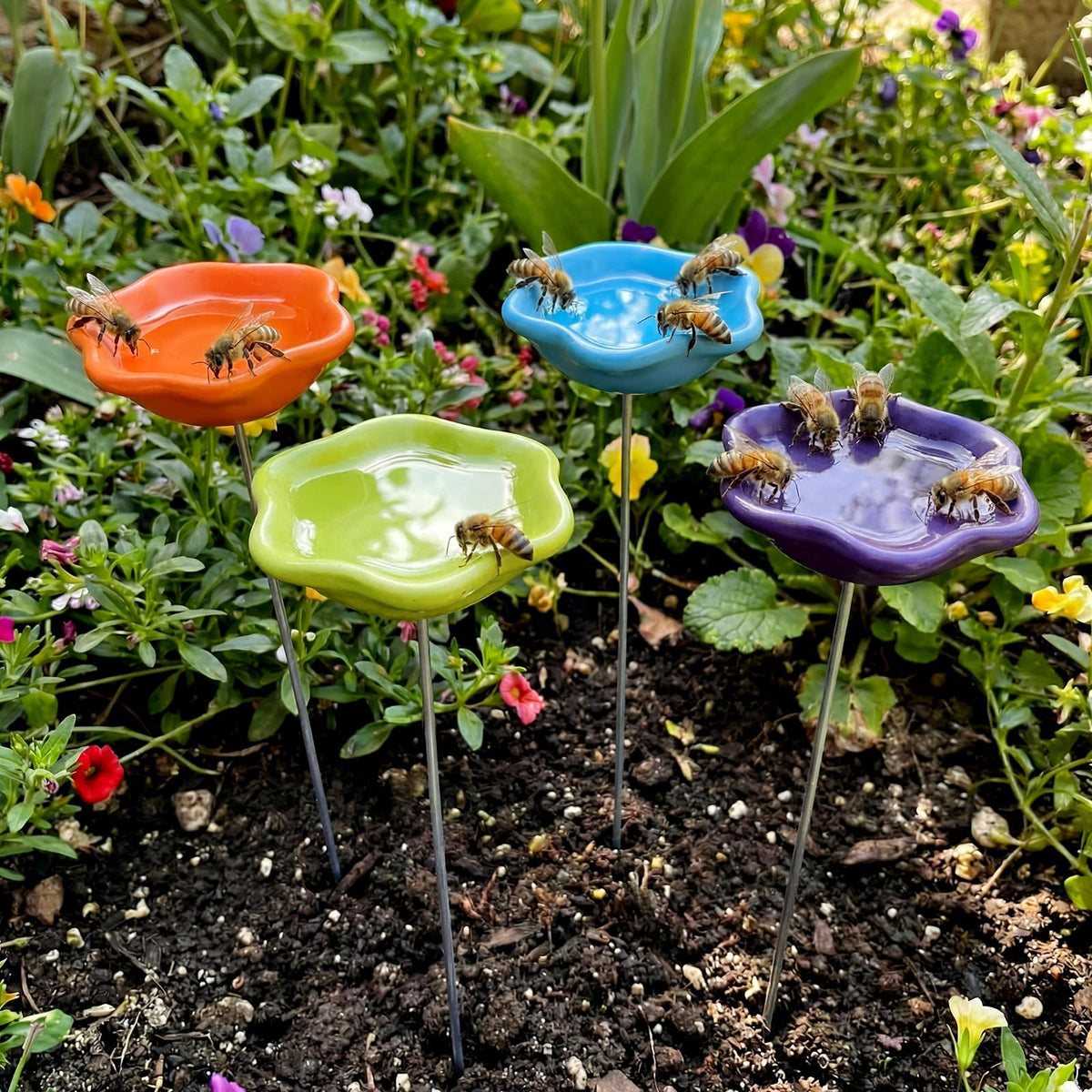 Ferrochef resin bee watering station orange color in garden offers safe drinking for pollinators