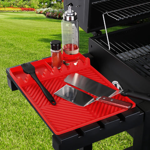 Find Law red silicone mat on kitchen counter adds organization.