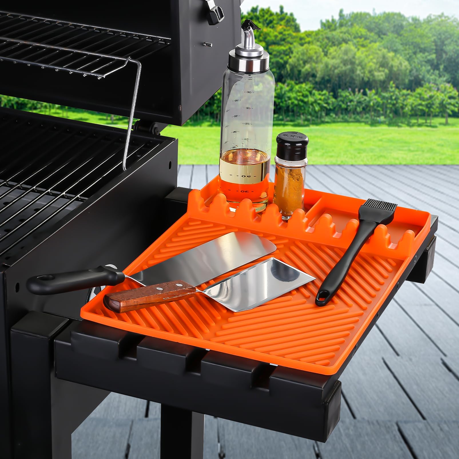 Find Law silicone tools mat orange on griddle shelf keeps utensils organized.