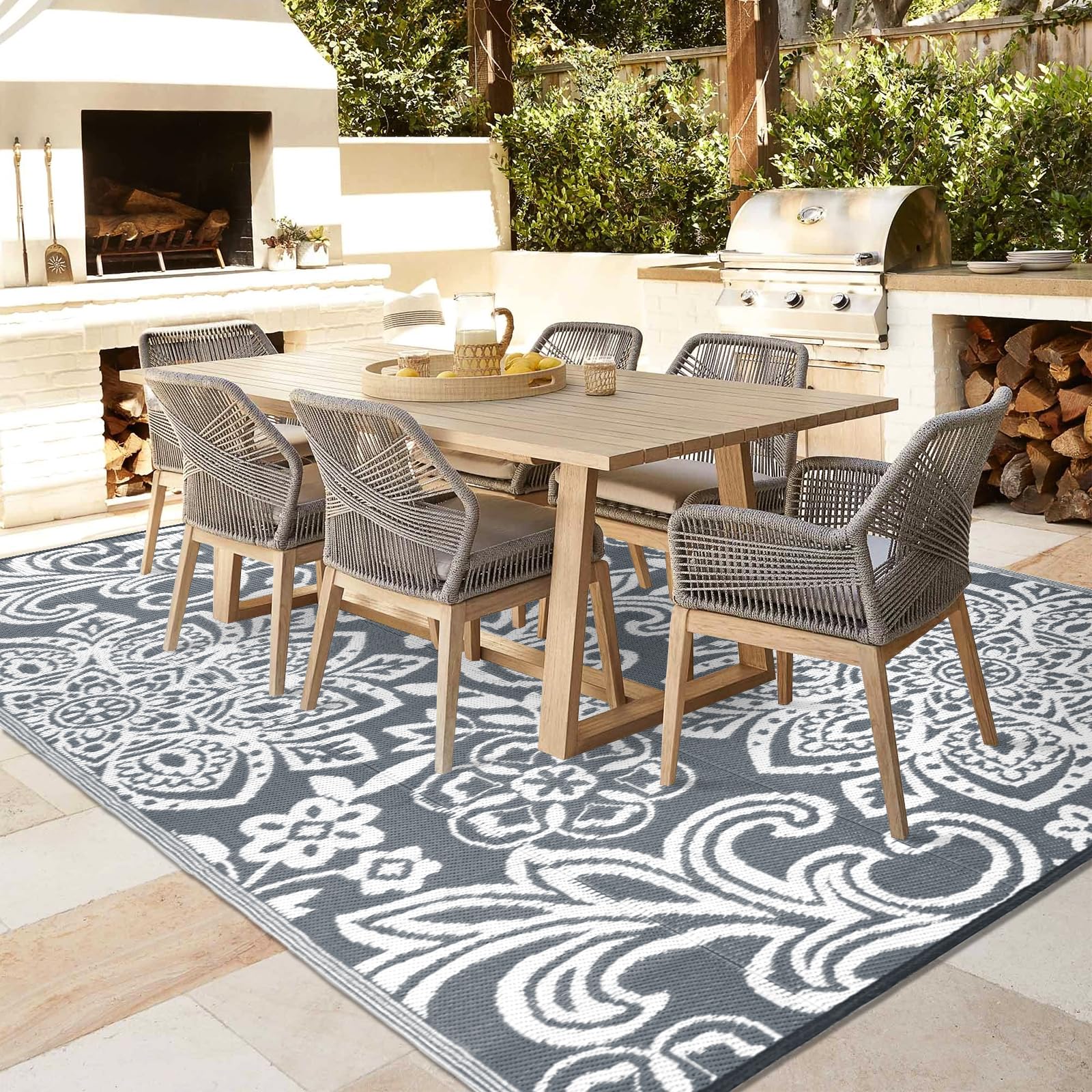 Findosom versatile outdoor rug placed on patio and beach scenes