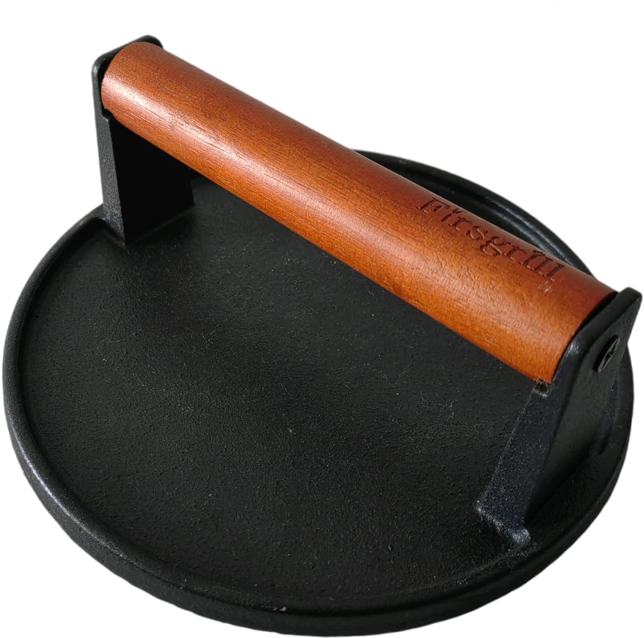 Firsgrill cast iron grill press with wood handle resting on grill for even sear