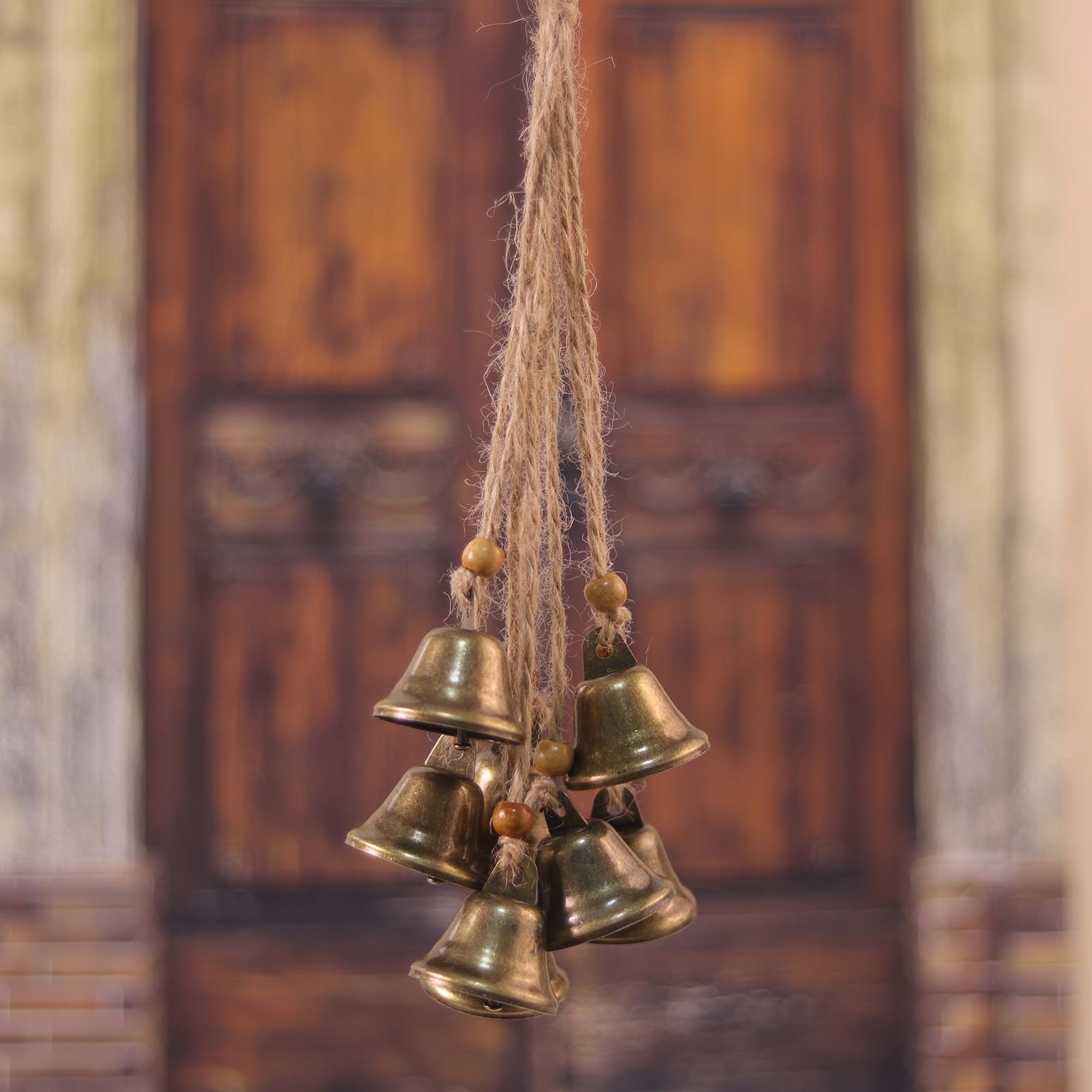 Fishknow antique-bronze bells with rope evoke cozy witchy decor