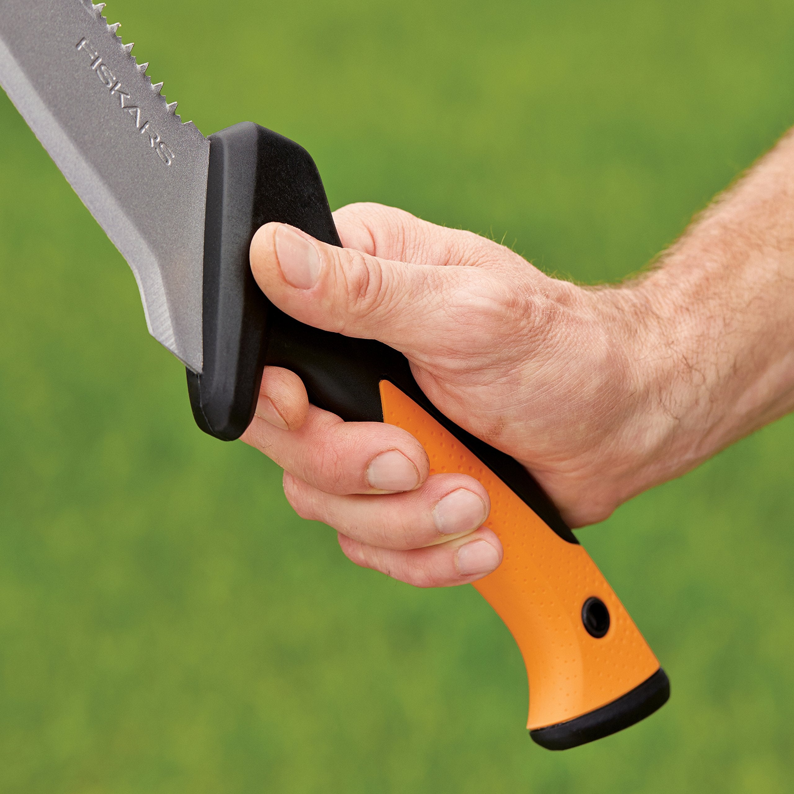 Fiskars billhook saw cutting through a small branch demonstrating action