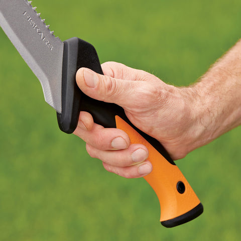 Fiskars billhook saw cutting through a small branch demonstrating action