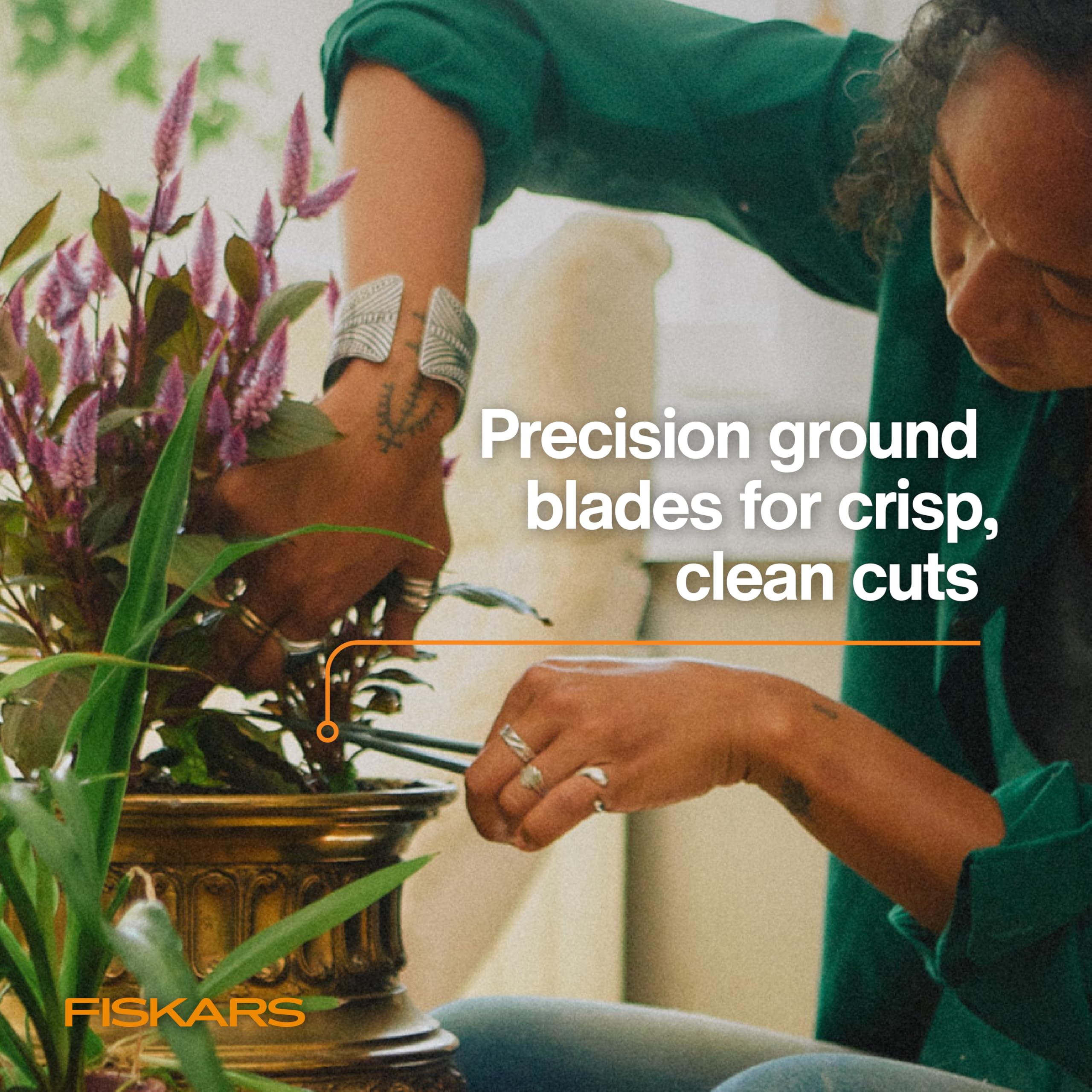 Dense foliage being trimmed smoothly with Fiskars stainless steel blades.