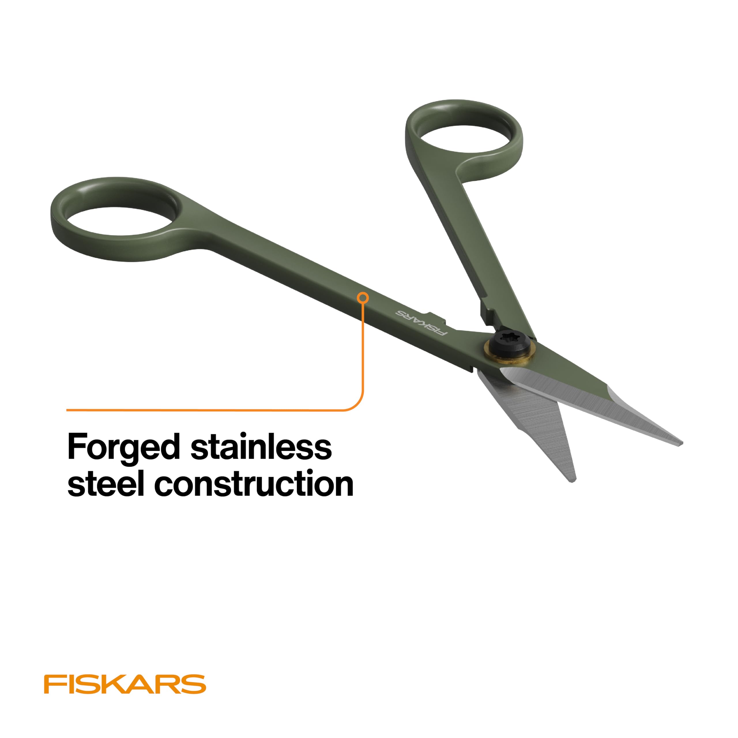 Precise detailing with Fiskars Snipper shaping small-leaf plants.