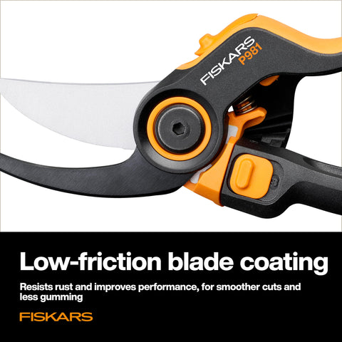 Fiskars DualAction Pruner cutting small branches in flower bed