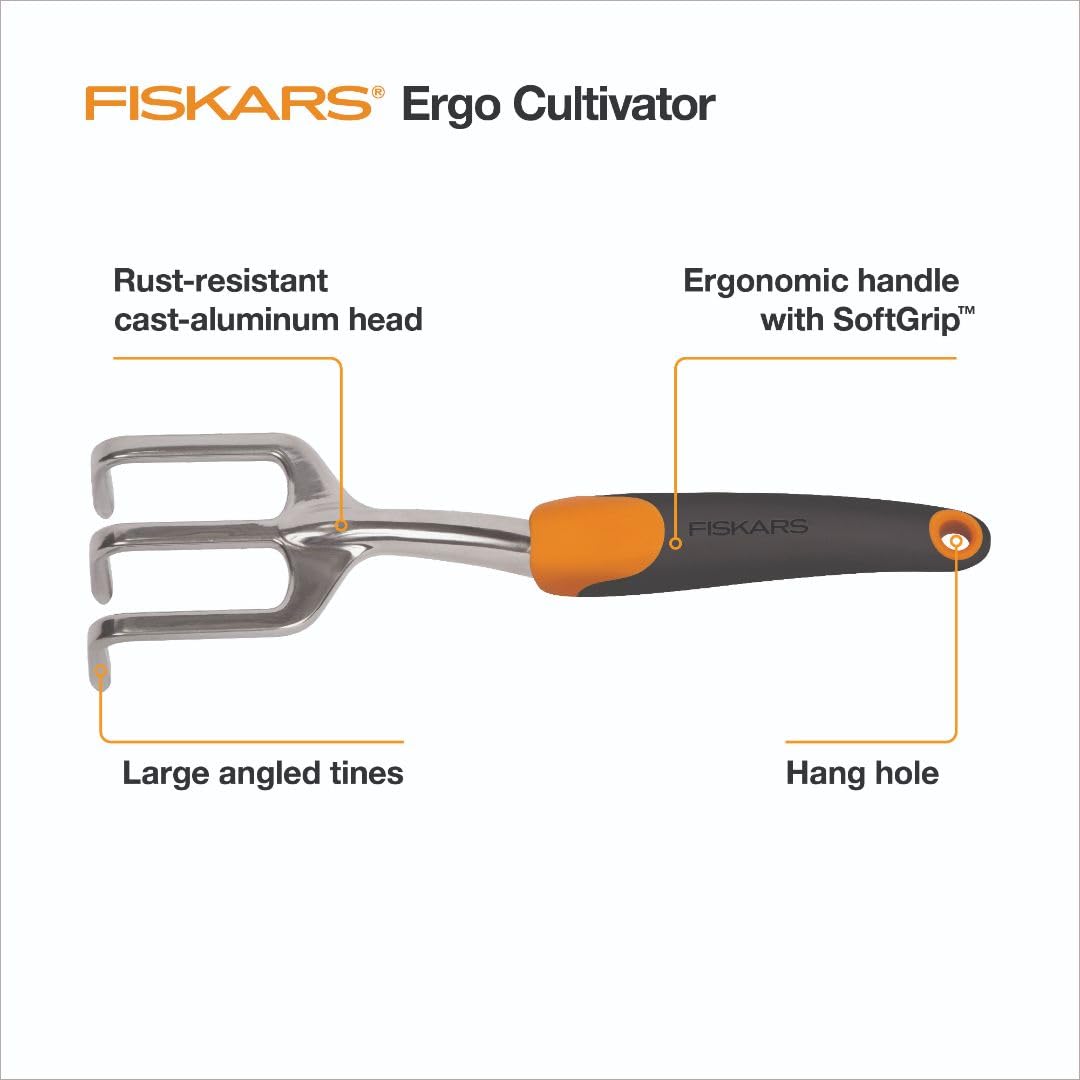 Fiskars Ergo Cultivator aerating soil to loosen compact beds with precision.