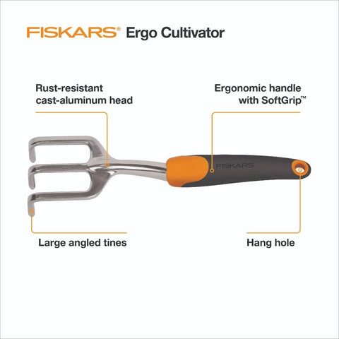 Fiskars Ergo Cultivator aerating soil to loosen compact beds with precision.
