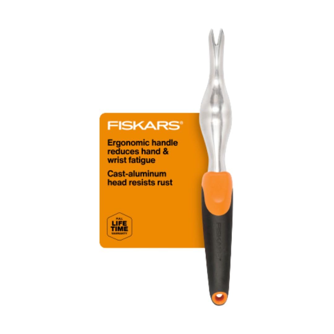 Fiskars Ergo Weeder angled-head demonstrates leverage for uprooting stubborn weeds.