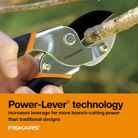 Ergonomic cushioned grip on the Fiskars pruner for comfort.