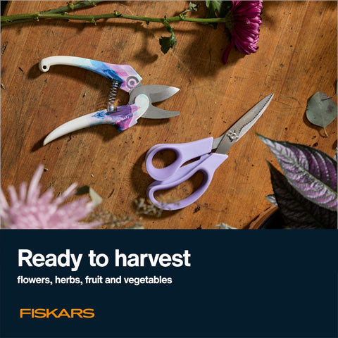 Fiskars Explore 2-piece set in use for pruning and harvesting