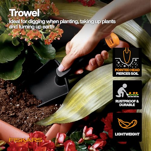 Fiskars cultivator with FiberComp for loosening soil and aeration.