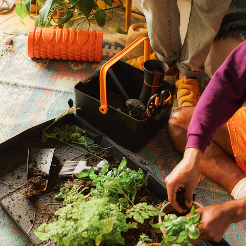 Fiskars Garden Tool Caddy spacious main compartment fits larger equipment.