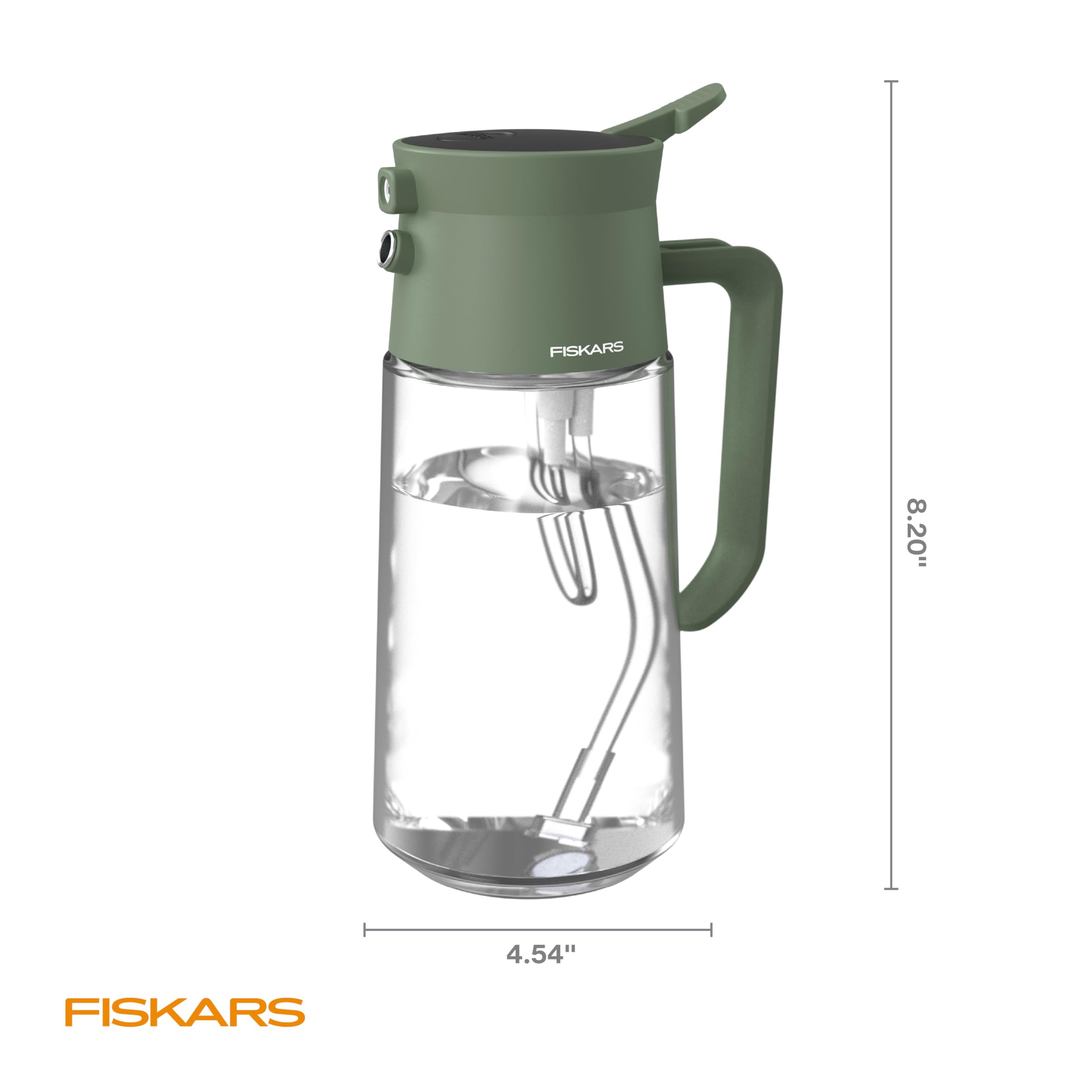 Fiskars glass carafe adds a chic touch to any indoor garden setup.