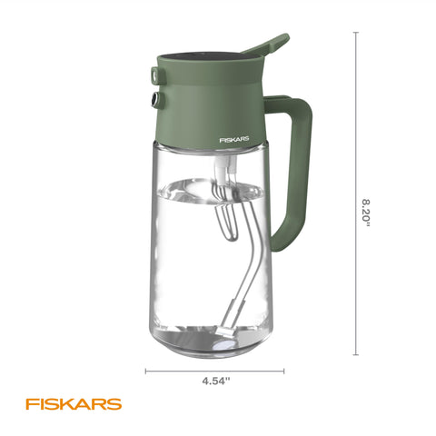 Fiskars glass carafe adds a chic touch to any indoor garden setup.