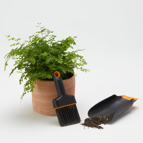 Fiskars Planting Soil Scoop & Brush Set keeps surfaces clean during cleanup