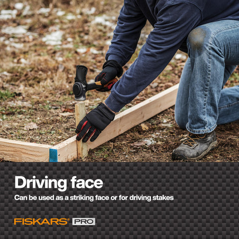 Fiskars Pro IsoCore Maul wood-splitting action in a rugged outdoor setting