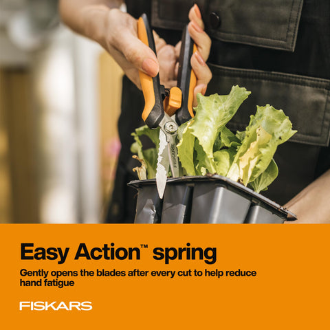 Fiskars serrated edge used for rope sawing in gardening tasks.