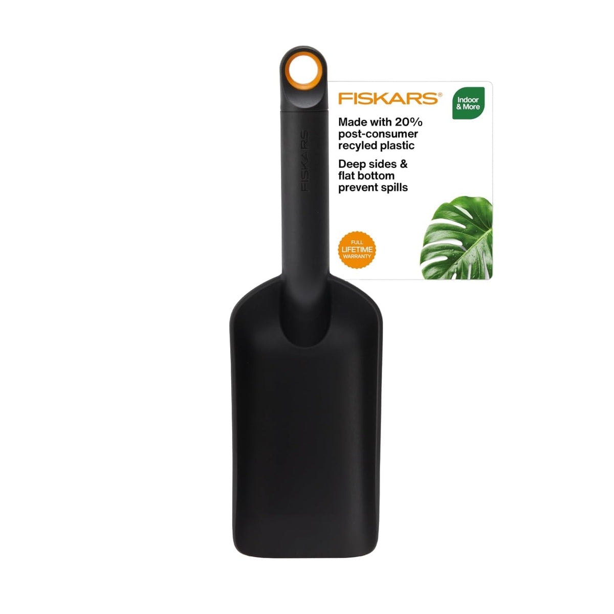 Fiskars soil scoop with flat-bottom design for stable indoor potting.