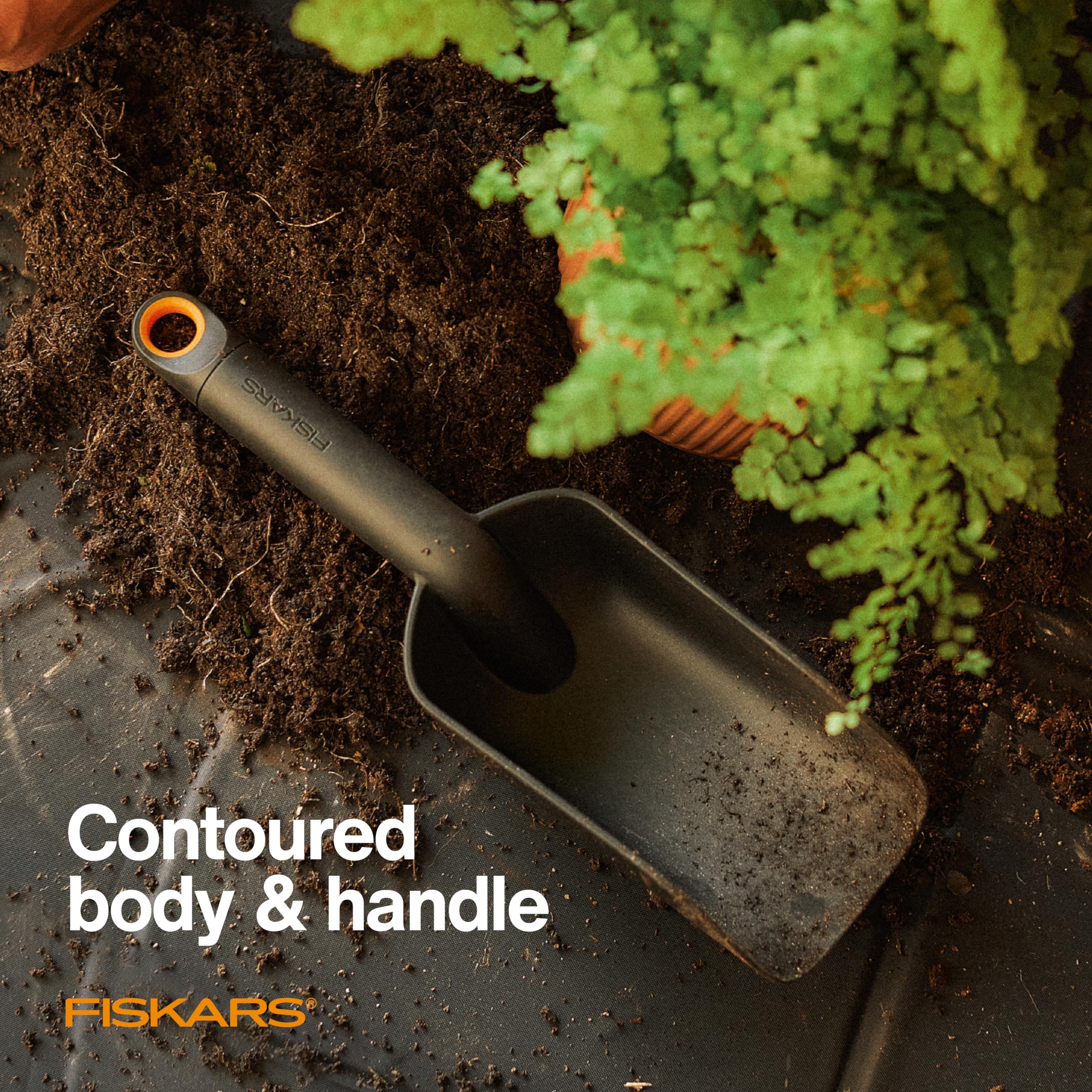 Fiskars soil scoop hang hole enables easy storage after use.