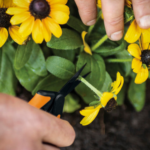 Fiskars stainless steel blades stay sharp through heavy use for reliable trimming.