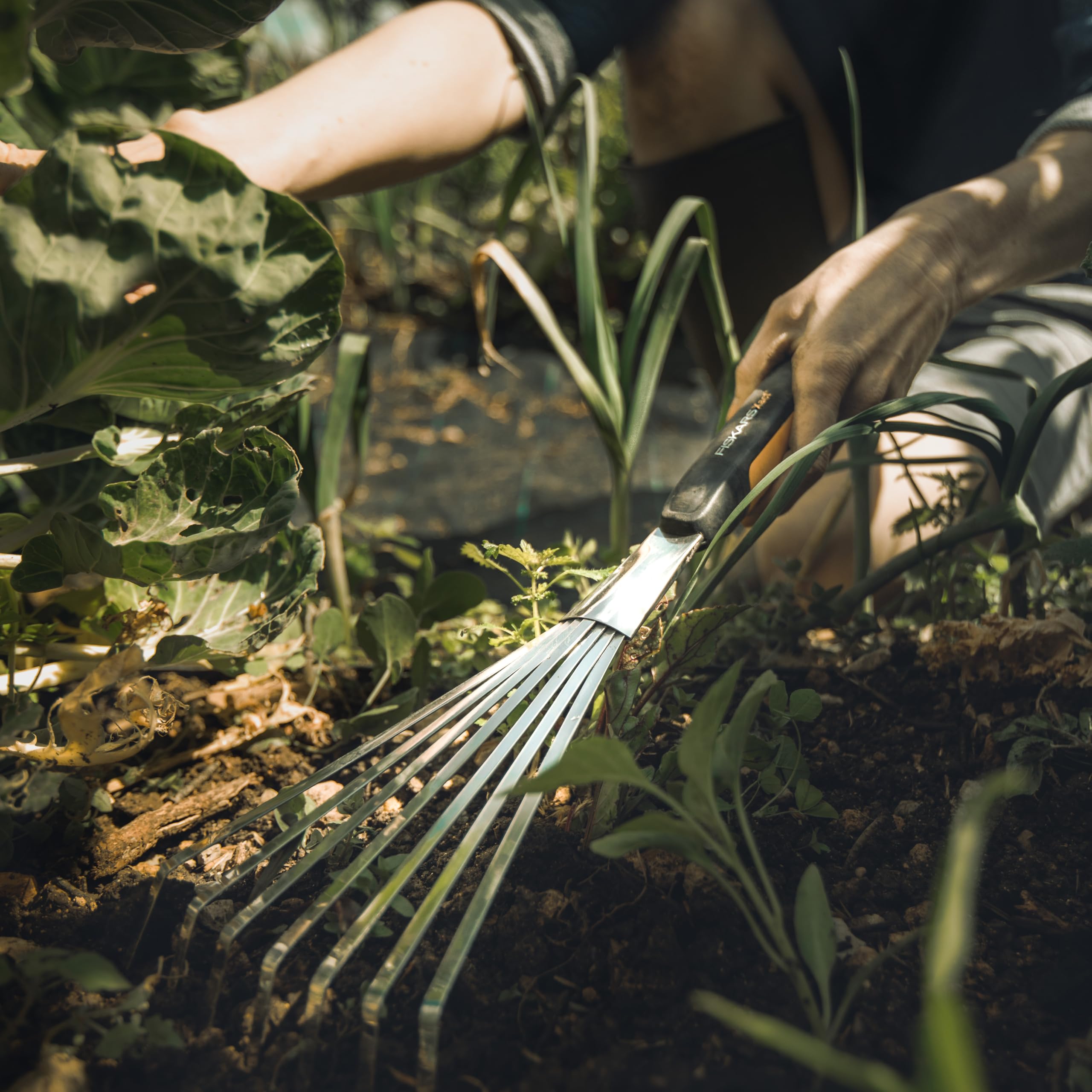 Fiskars Xact Hand Rake SoftGrip handle enhances comfort and balance.
