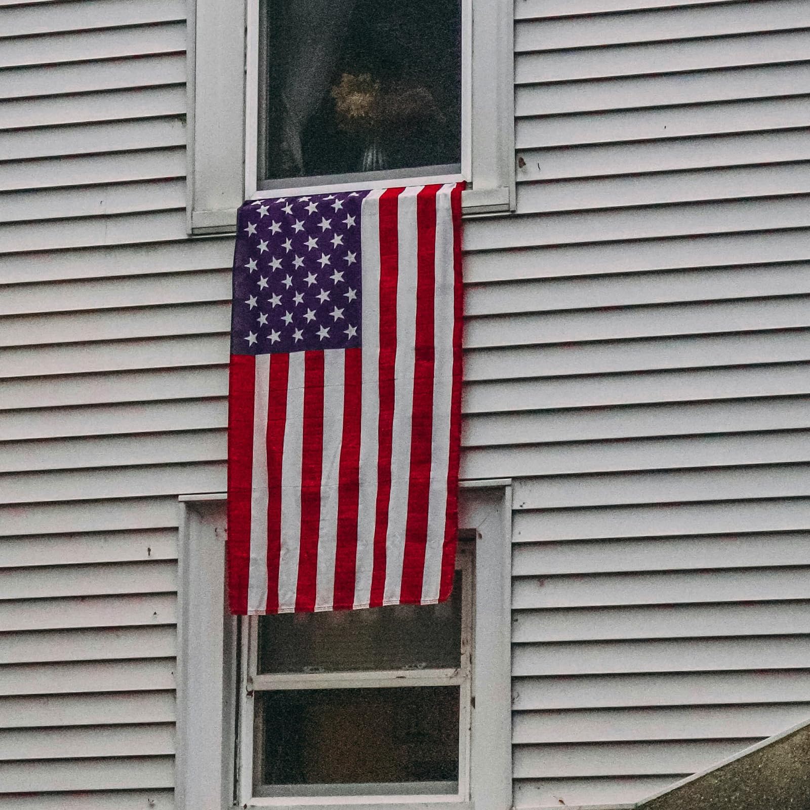 Flagolden outdoor flag on a pole ready for quick display.