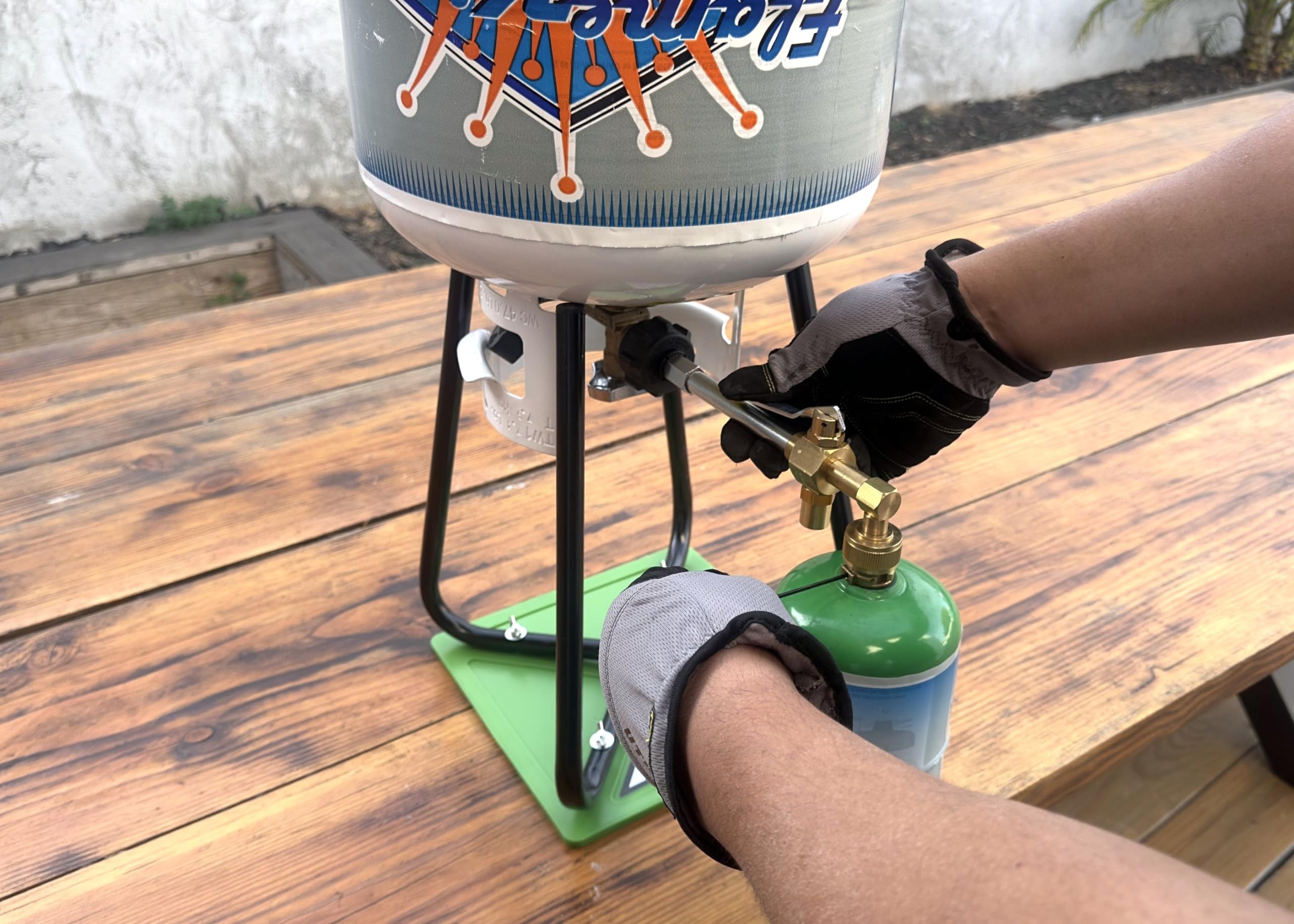 Flame King adapter in use shows safe, tidy fuel transfer for home refilling.