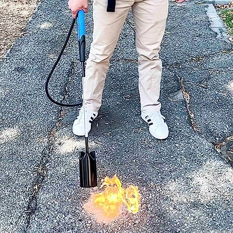 Flame King torch removing paint from pavement surfaces