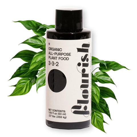 Flourish Plant Food bottle label clearly displays the 3-3-2 NPK ratio for balanced feeding.