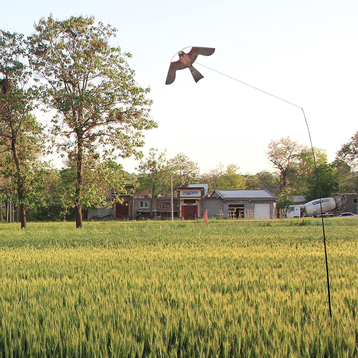 Flyonte Bird Hawk Flying Kite enhances crop protection with wind-powered action.