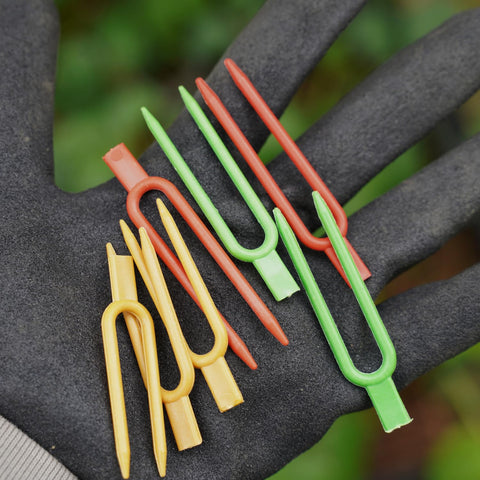 Foinfun strawberry pin being inserted easily for secure placement.