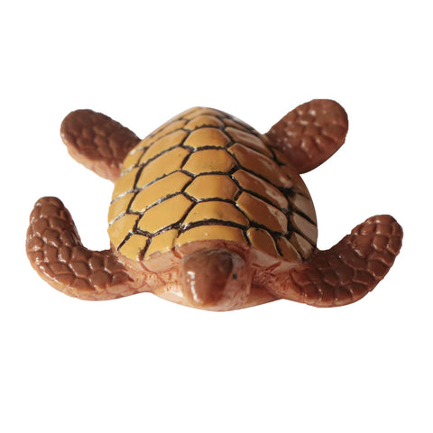 Folytiy sea turtle miniature figurine shown in a terrarium setup for display.
