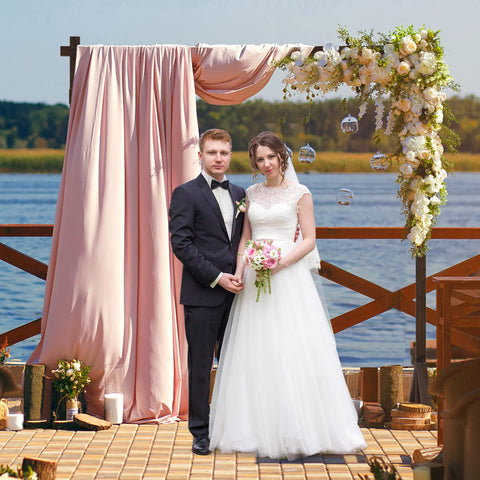 Fomcet wooden arch used in garden or beach ceremony for rustic boho vibe