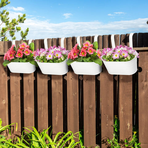 Foraineam metal planters brighten brick walls and porches with flowers.
