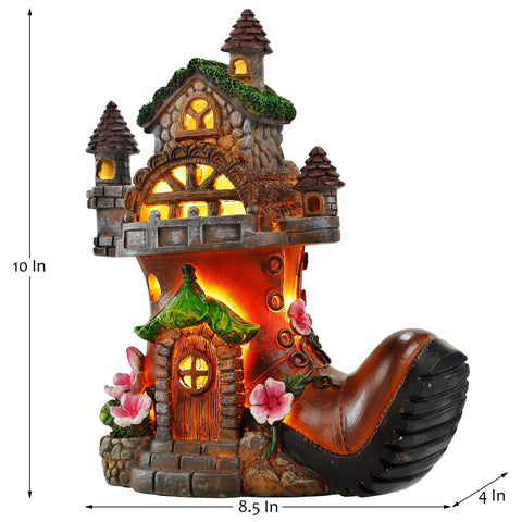 FORUP solar powered fairy house lights illuminate garden paths after sunset.