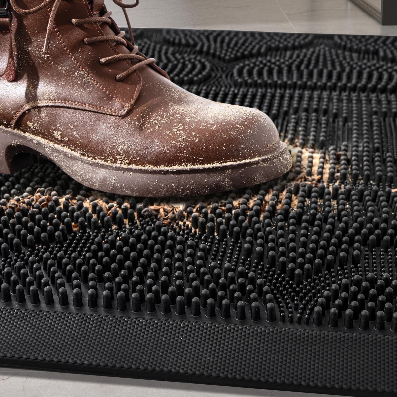 FRAMICS Low-profile doormat fits under doors while trapping dirt.