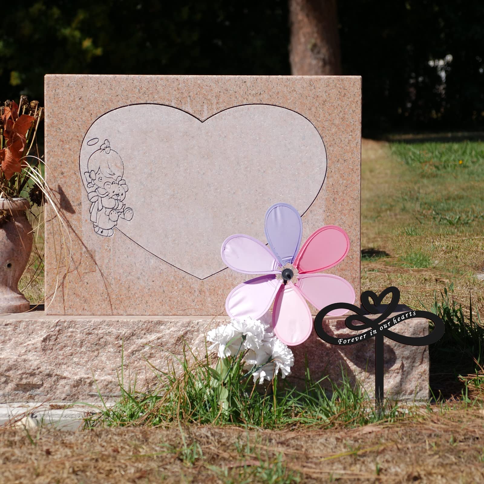 Fumete memorial stake with dimensions 9.65 by 11.81 inches placed in soil