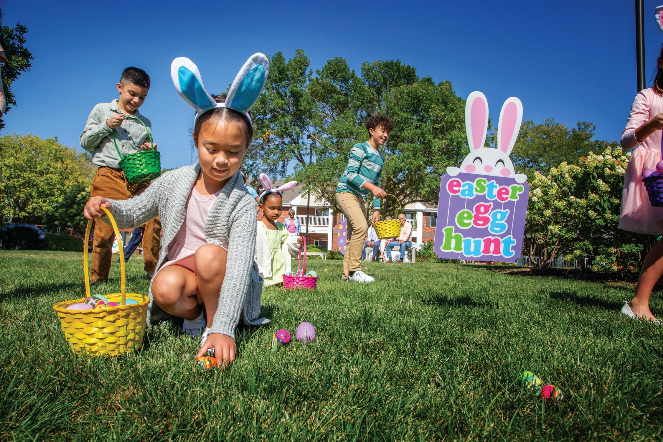 Fun Express multicolor eggs create festive photo moments outdoors.