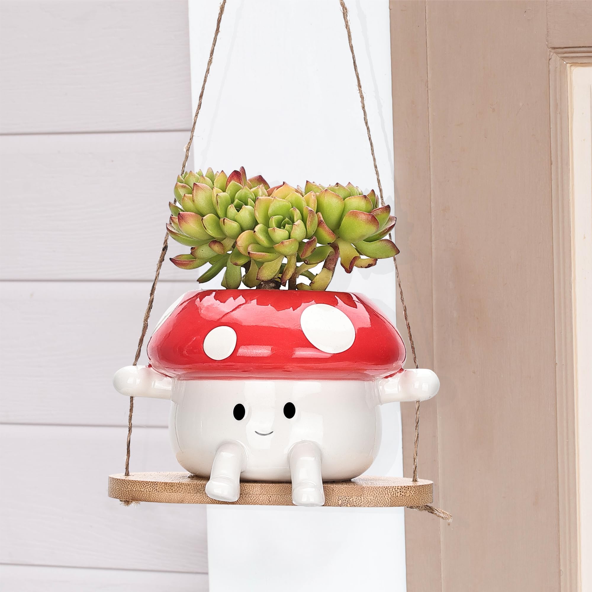 Outdoor balcony setup with Fungi Fun red and white mushroom planter.