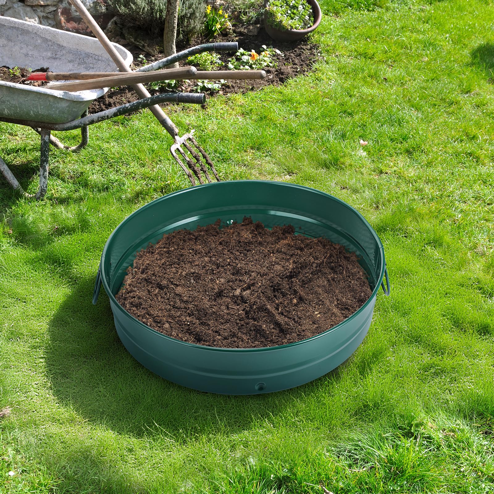Funnymoom green garden sifter in use for soil and rocks