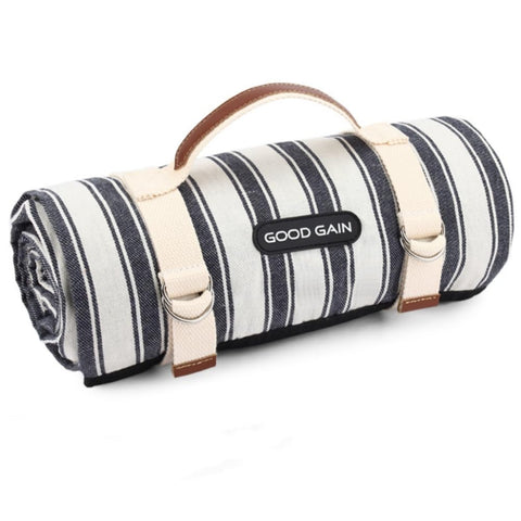 G GOOD GAIN waterproof picnic blanket unfolded on grass, showcasing ample space for family time.