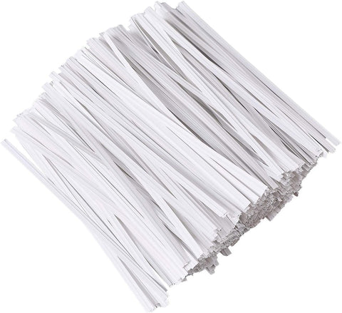 Gadget Beyond reusable white paper twist ties sealing bread bags.